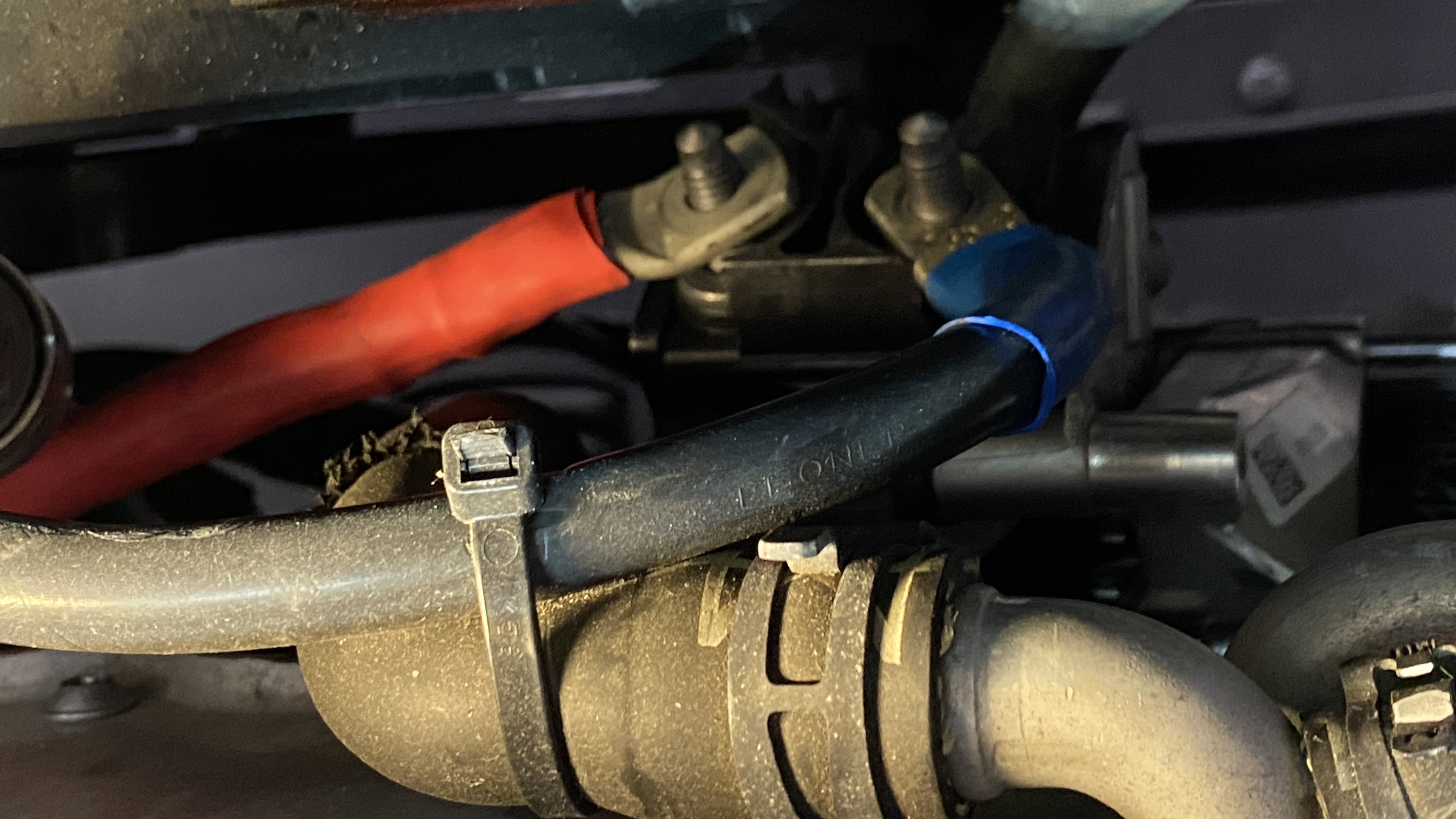 Wires in a car engine compartment.