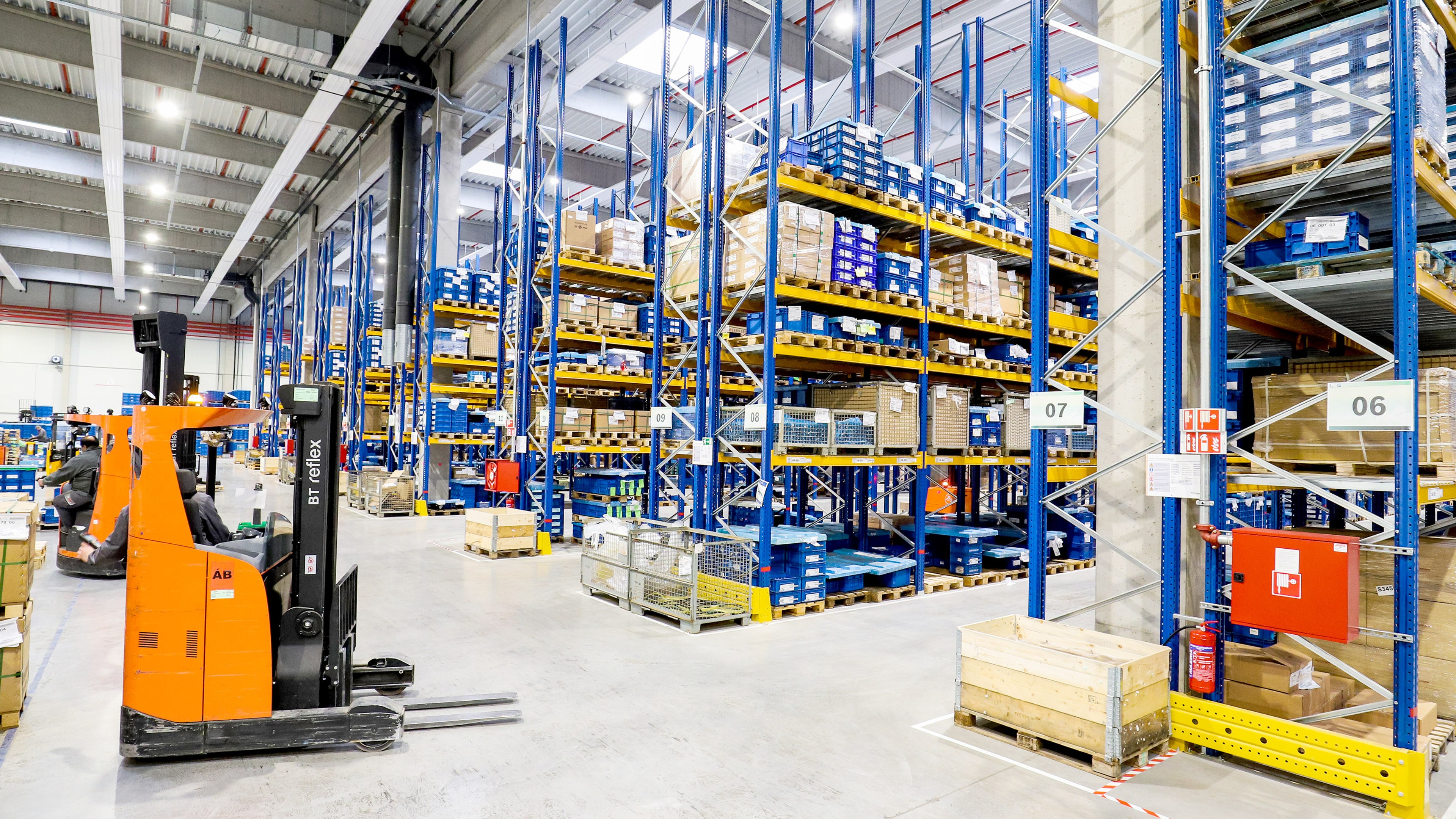 High racks and forklift in a logistics center