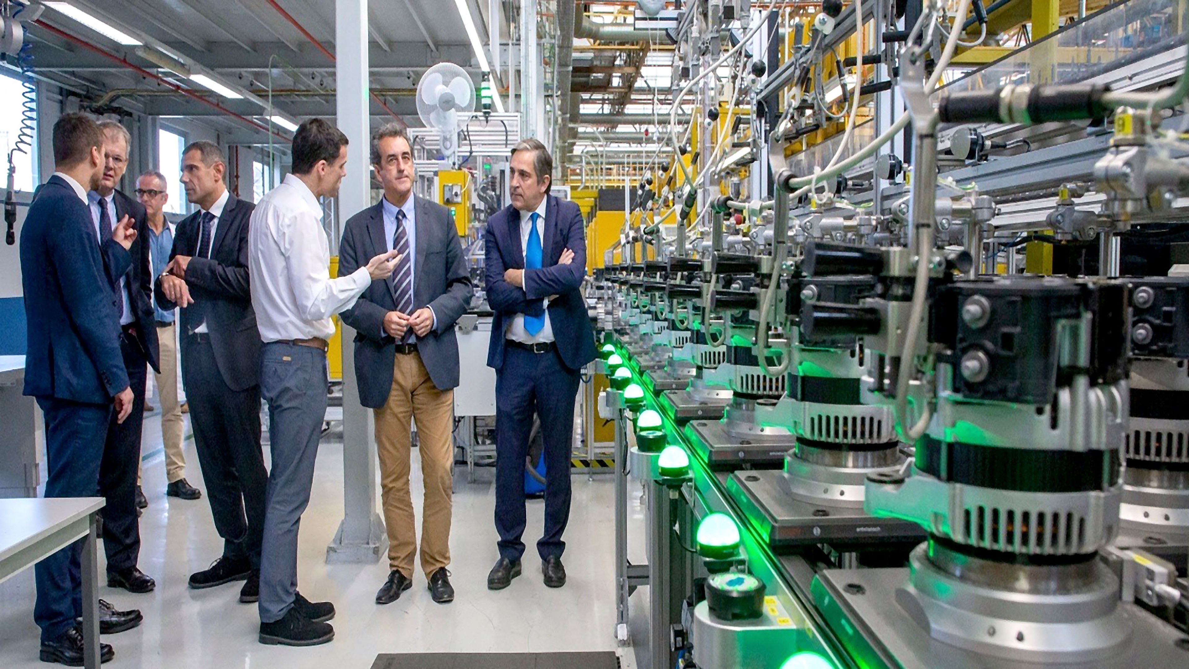 Group of people viewing generator production in an SEG facility